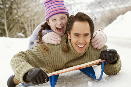 Father and Daughter Sledding